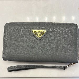 Designer inspired grey wristlet. Genuine leather
